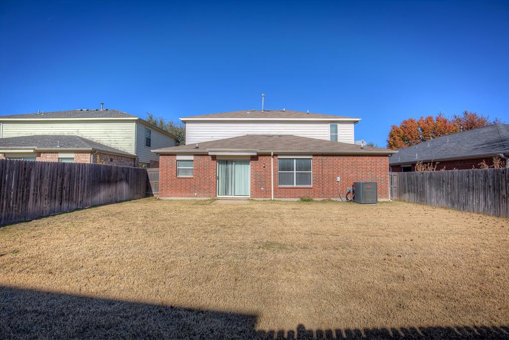 1720 Desperado Road Fort Worth, TX 76131 - Photo 38 of 40 a front view of a house with a yard