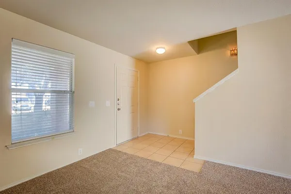 a view of a big room with windows and wardrobe