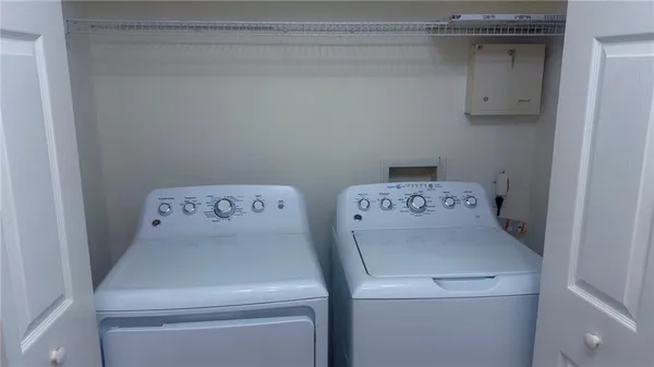 a utility room with dryer and washer