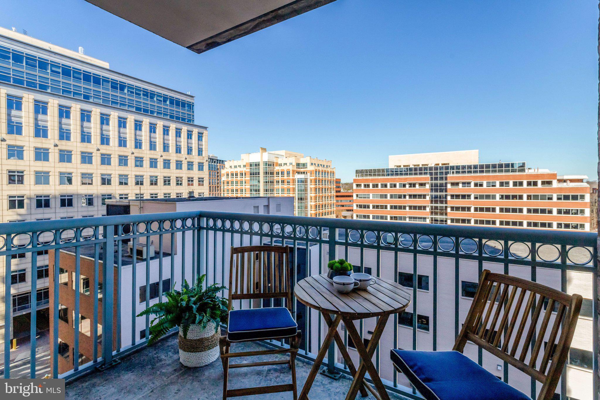 851 North Glebe Road, Unit 812 Arlington, VA 22203 - Photo 14 of 38 a view of a balcony with chairs
