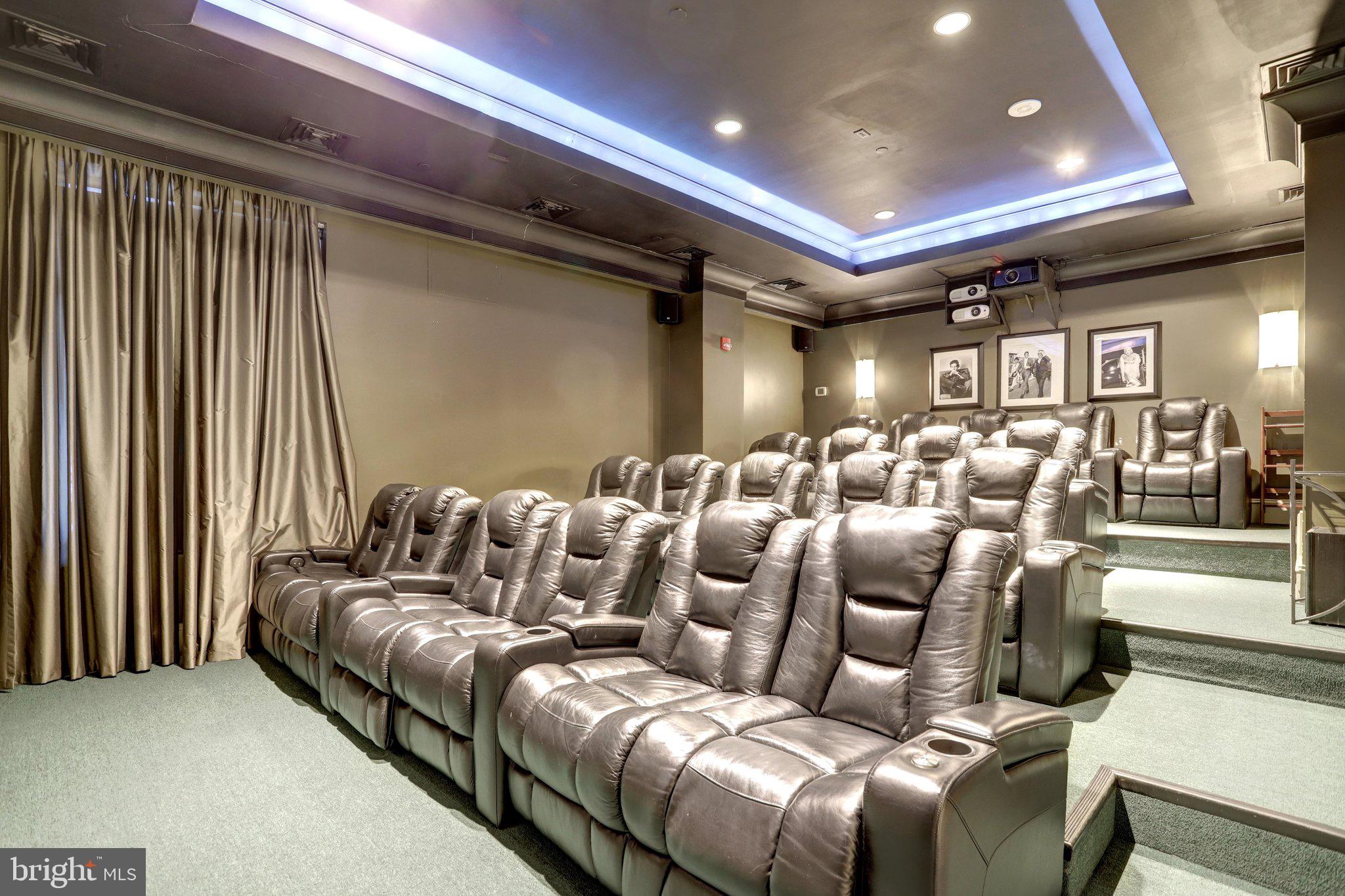 851 North Glebe Road, Unit 812 Arlington, VA 22203 - Photo 26 of 38 a media room with lots of chairs and a projector