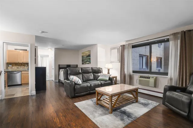 a living room with furniture and a window