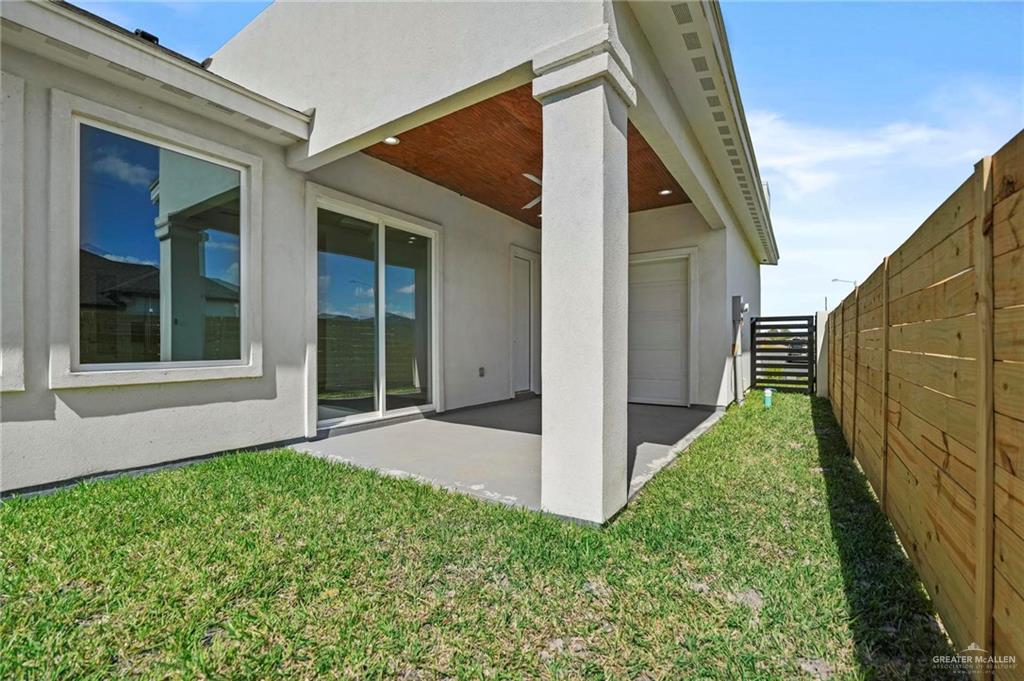 2716 East Conroe Road Edinburg, TX 78542 - Photo 29 of 31 Rear view of property featuring a fenced backyard, a patio, stucco siding, and ceiling fan