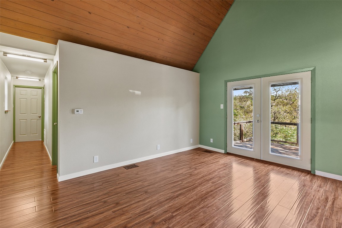 4301 Stearn's Lane Austin, TX 78745 - Photo 11 of 39 a view of an empty room with wooden floor and a window