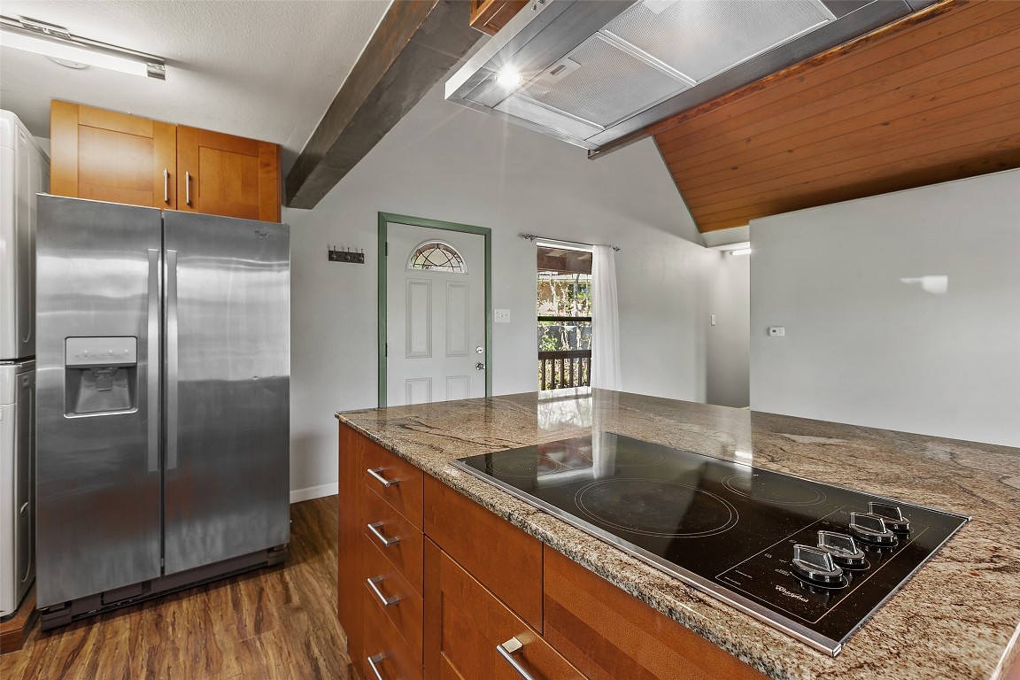 4301 Stearn's Lane Austin, TX 78745 - Photo 16 of 39 a kitchen with stainless steel appliances granite countertop a sink a refrigerator and a stove