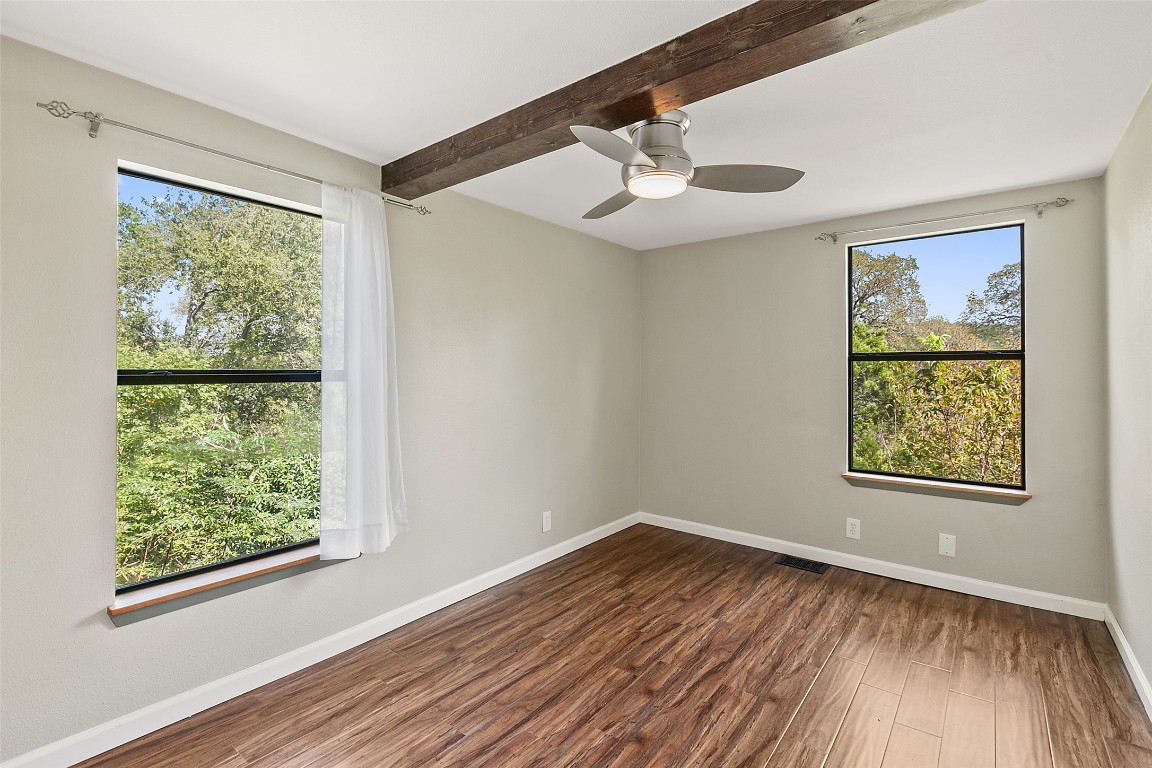 4301 Stearn's Lane Austin, TX 78745 - Photo 21 of 39 a view of an empty room with wooden floor and a window