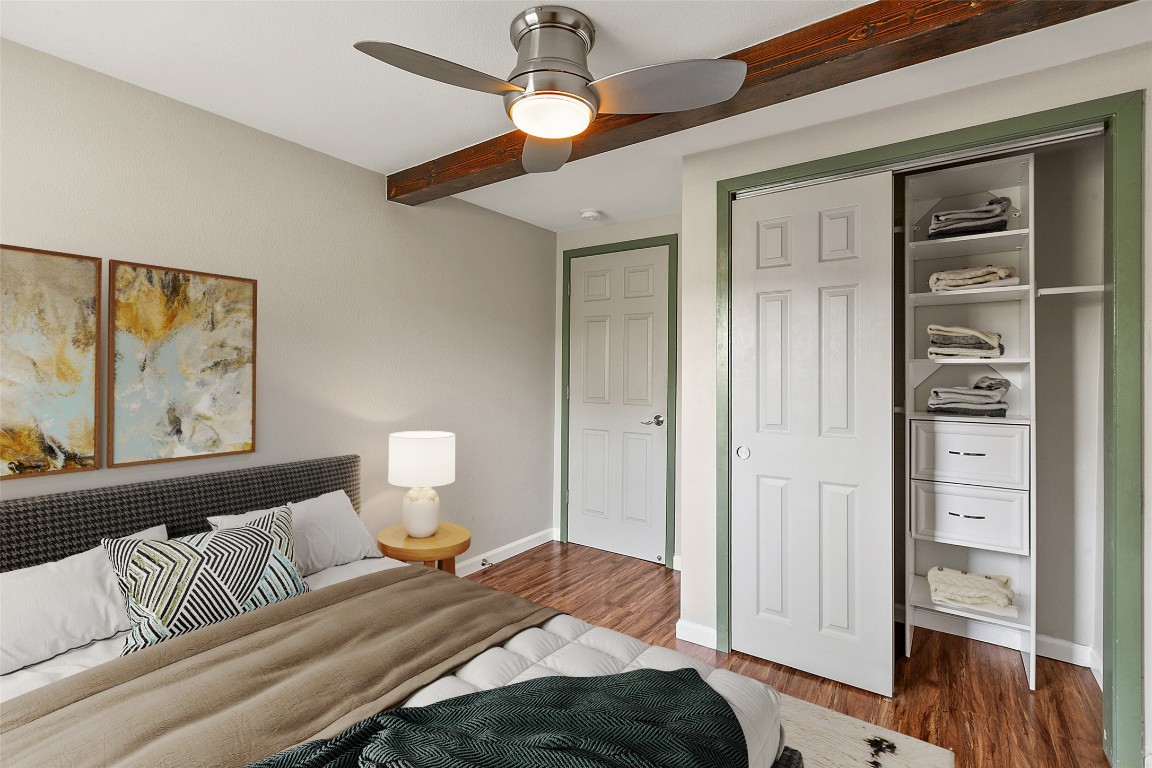 4301 Stearn's Lane Austin, TX 78745 - Photo 23 of 39 a bedroom with a bed and wooden floor