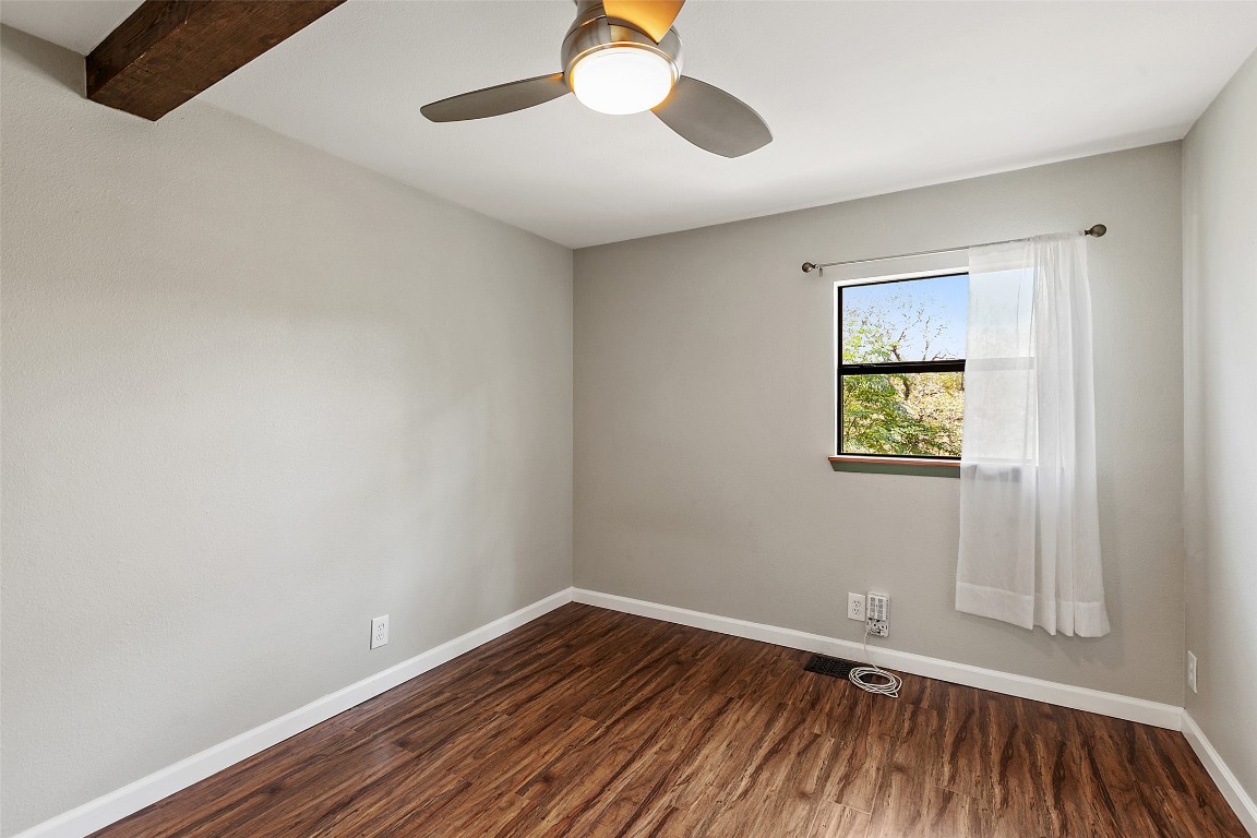 4301 Stearn's Lane Austin, TX 78745 - Photo 25 of 39 a view of an empty room with wooden floor and a window