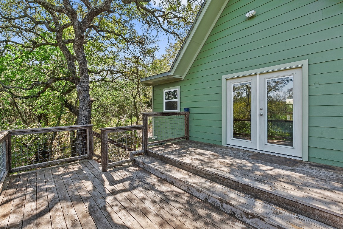 4301 Stearn's Lane Austin, TX 78745 - Photo 30 of 39 a view of a backyard with table and chairs and wooden fence