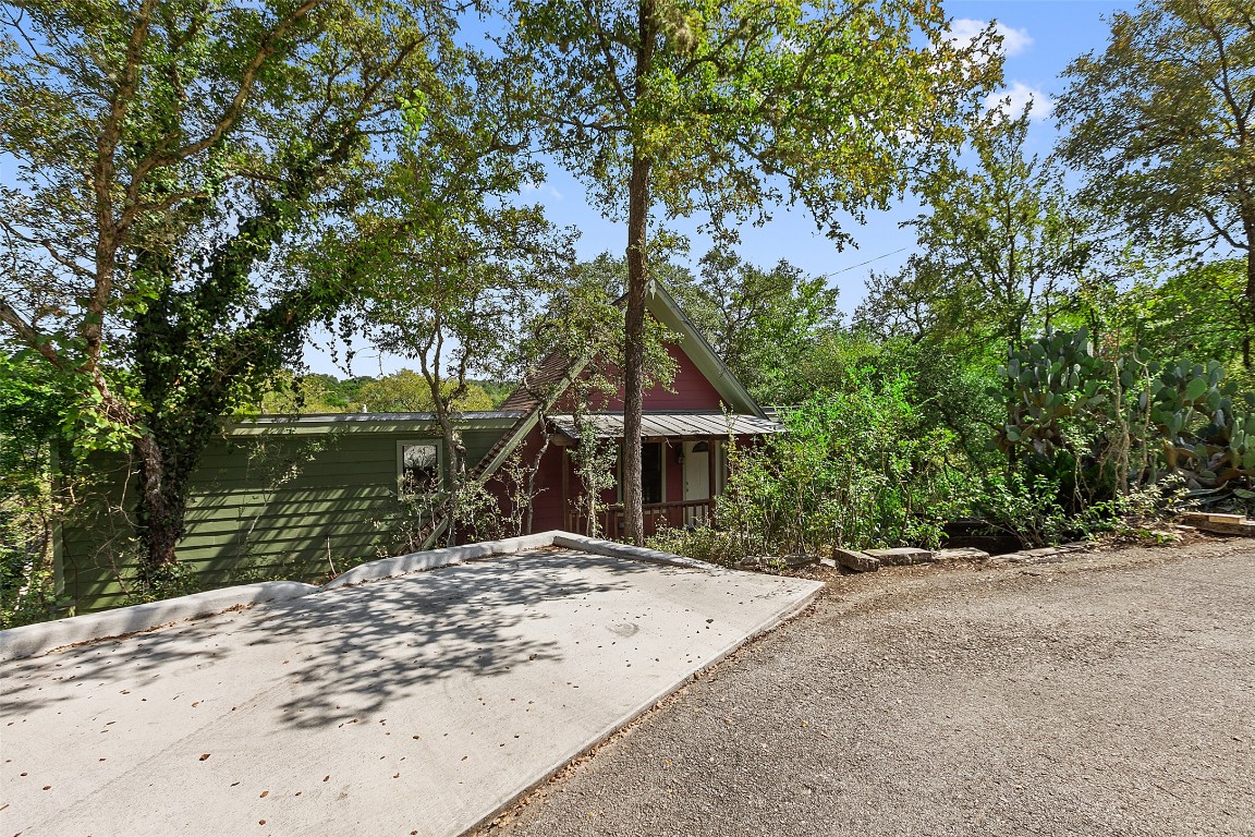 4301 Stearn's Lane Austin, TX 78745 - Photo 4 of 39 a front view of a house with a yard and lake view