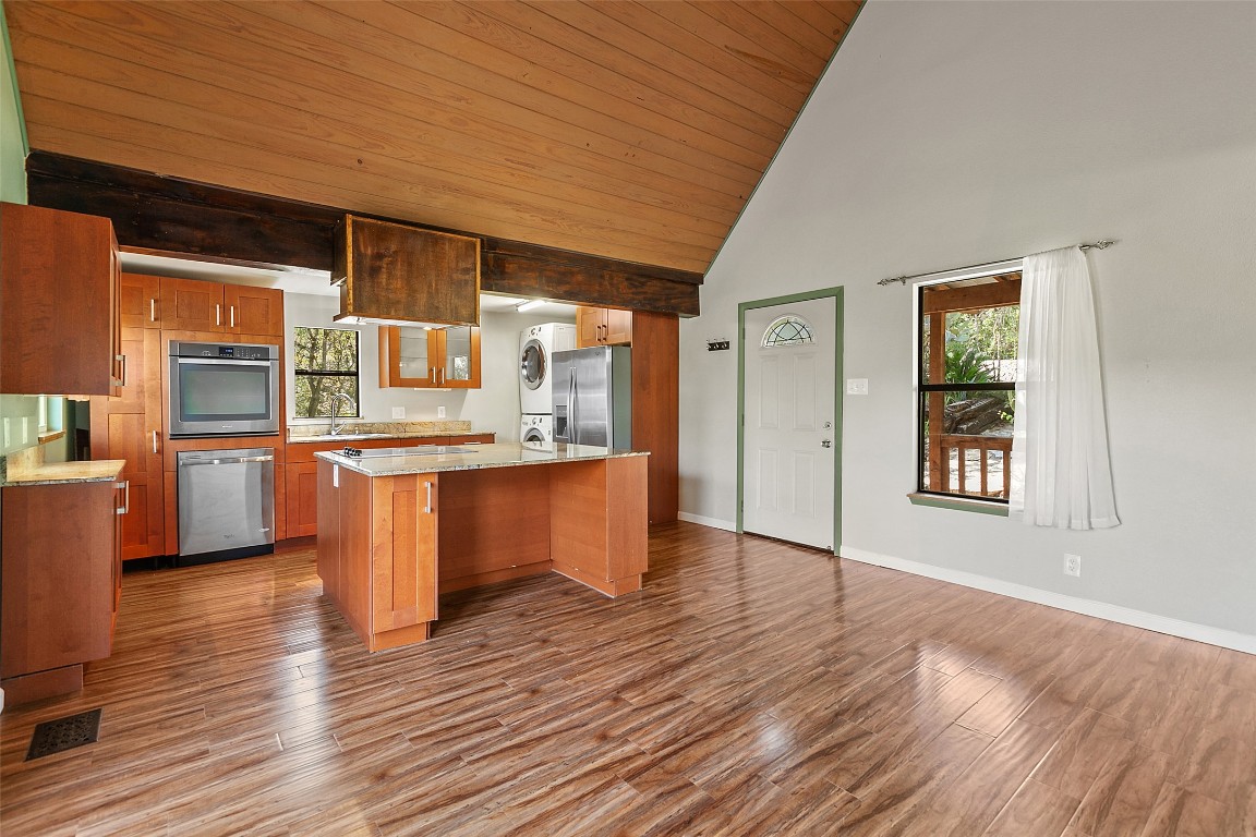 4301 Stearn's Lane Austin, TX 78745 - Photo 10 of 39 a large kitchen with wooden floors and stainless steel appliances