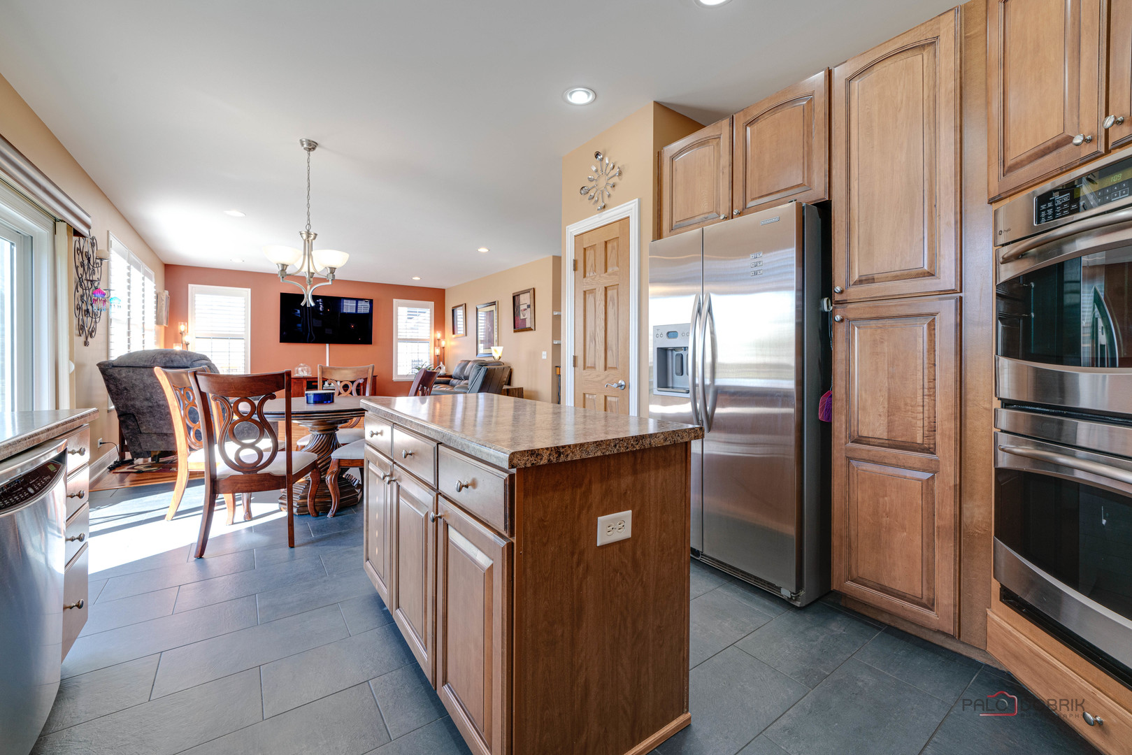 288 Shelbourne Road Volo, IL 60073 - Photo 11 of 33 a kitchen with stainless steel appliances kitchen island granite countertop a refrigerator and a stove top oven