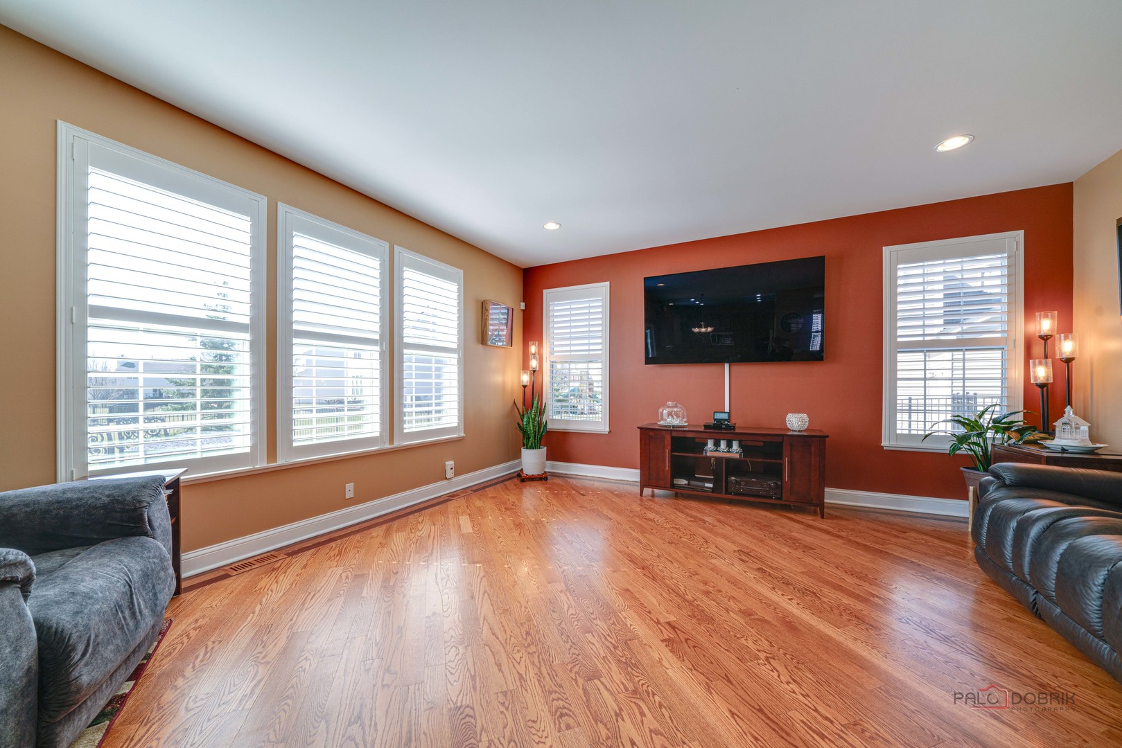 288 Shelbourne Road Volo, IL 60073 - Photo 14 of 33 a living room with furniture and a flat screen tv with wooden floor