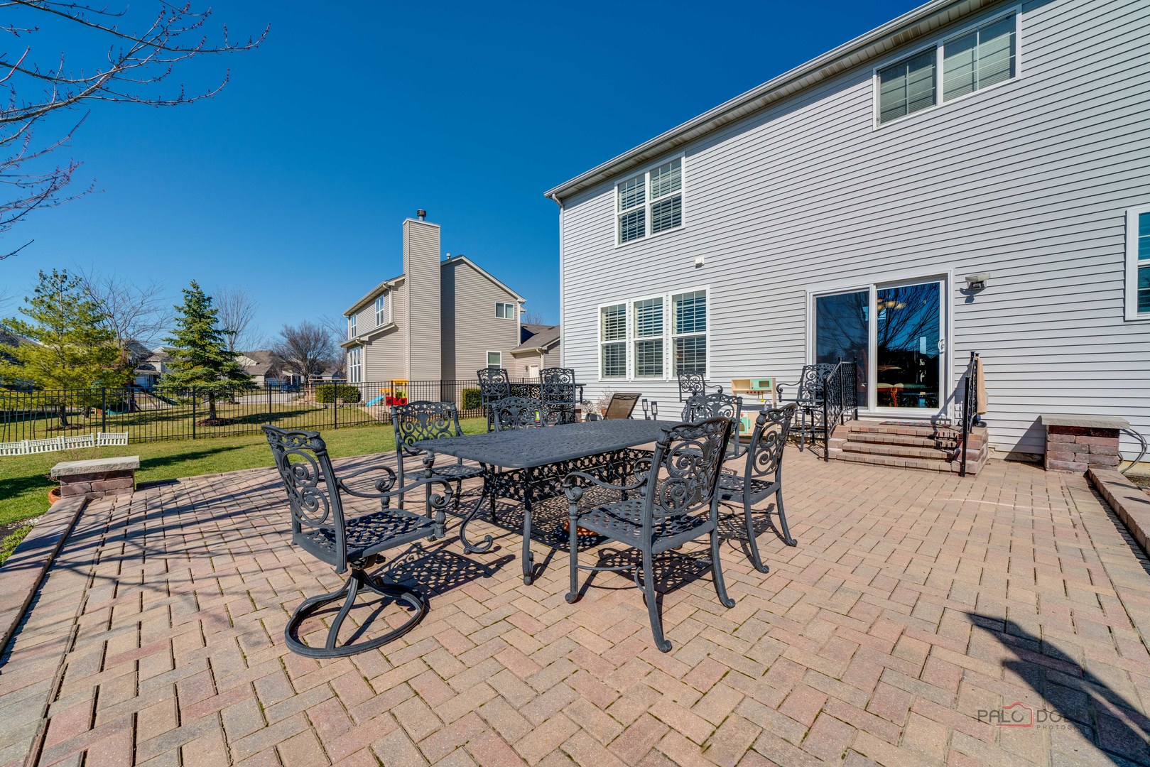 288 Shelbourne Road Volo, IL 60073 - Photo 27 of 33 a view of a patio with table and chairs with wooden floor and fence