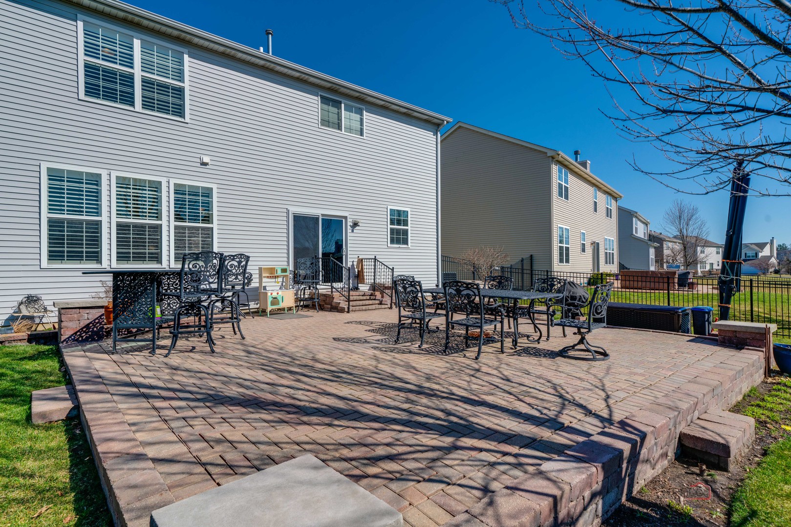 288 Shelbourne Road Volo, IL 60073 - Photo 32 of 33 a view of a patio with table and chairs and potted plants