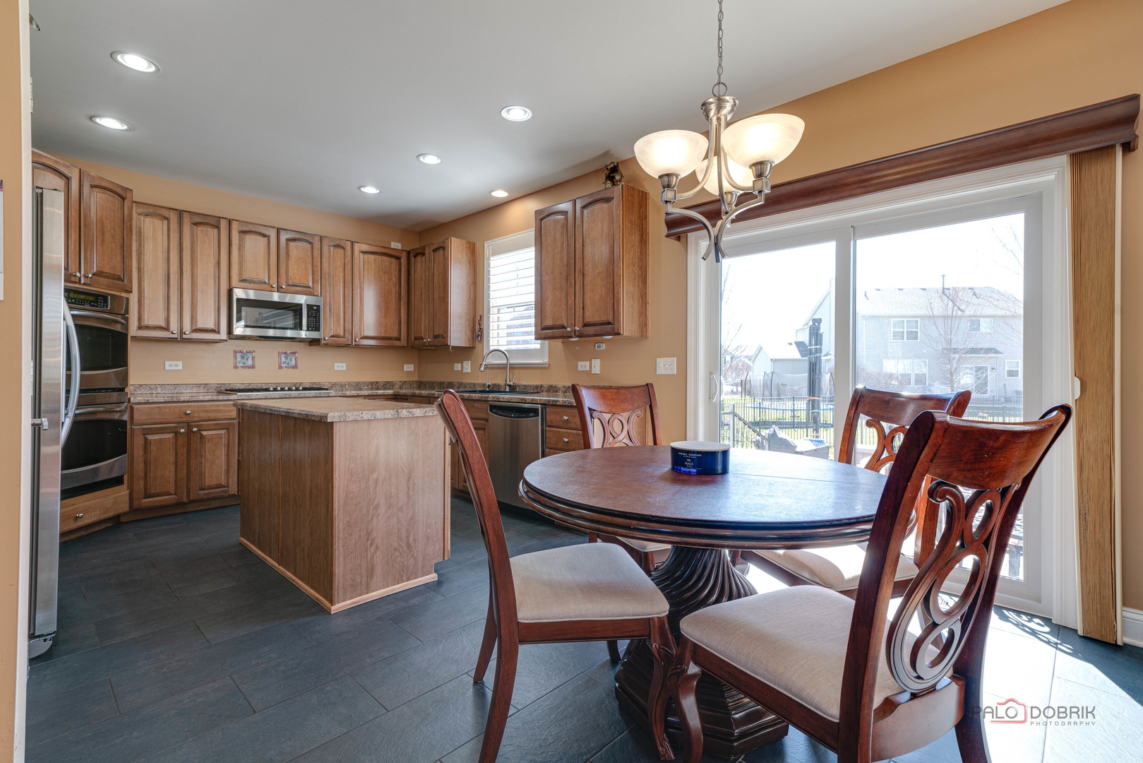 288 Shelbourne Road Volo, IL 60073 - Photo 10 of 33 a view of a dining room with furniture window and outside view
