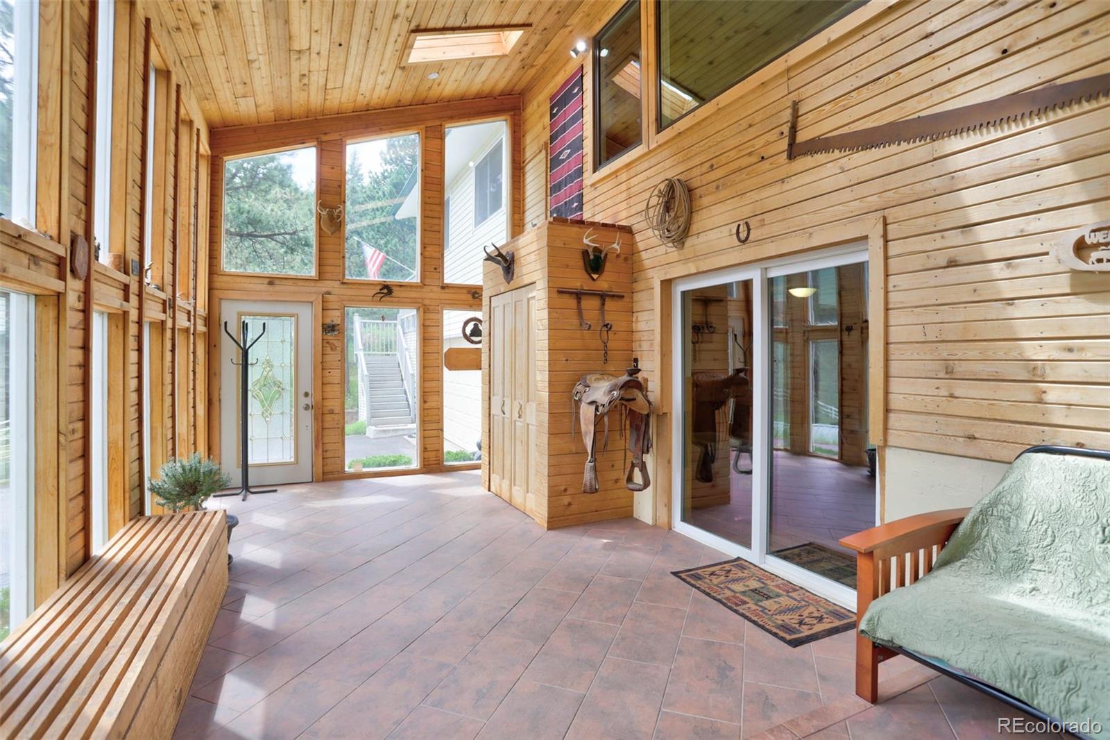 12079 Tecumseh Trail Conifer, CO 80433 - Photo 7 of 38 a view of a building with a lounge chair