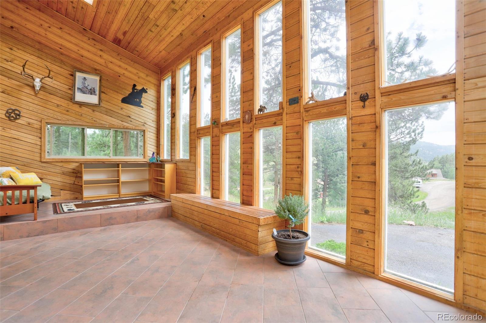 12079 Tecumseh Trail Conifer, CO 80433 - Photo 8 of 38 a view of an empty room and window