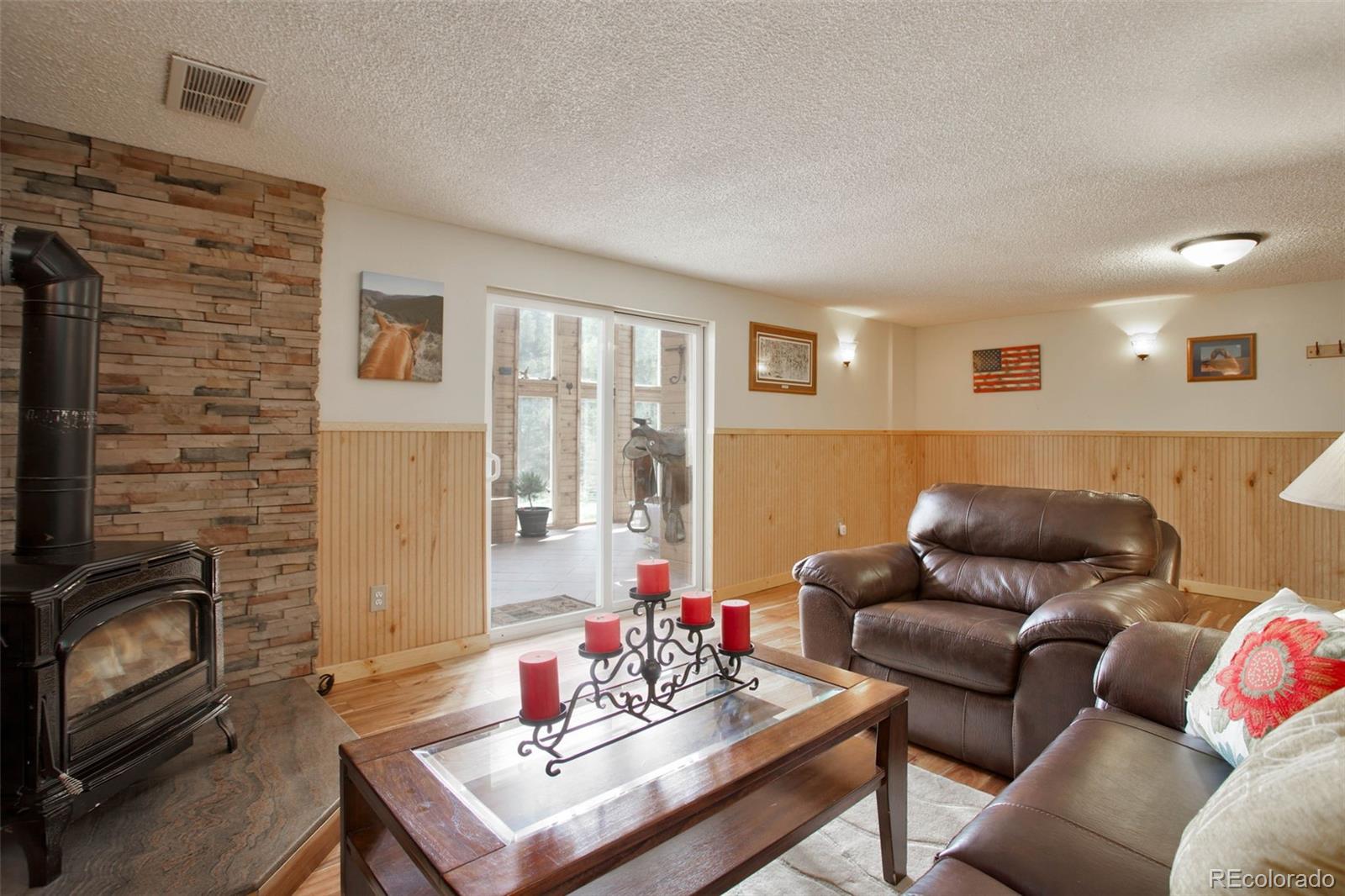 12079 Tecumseh Trail Conifer, CO 80433 - Photo 10 of 38 a living room with furniture and a fireplace