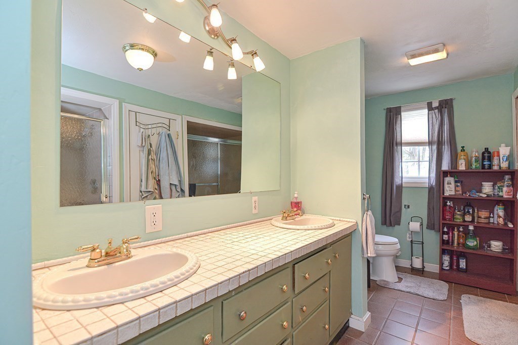 34 South Spencer Road Spencer, MA 01562 - Photo 12 of 34 a bathroom with a sink double vanity and a toilet