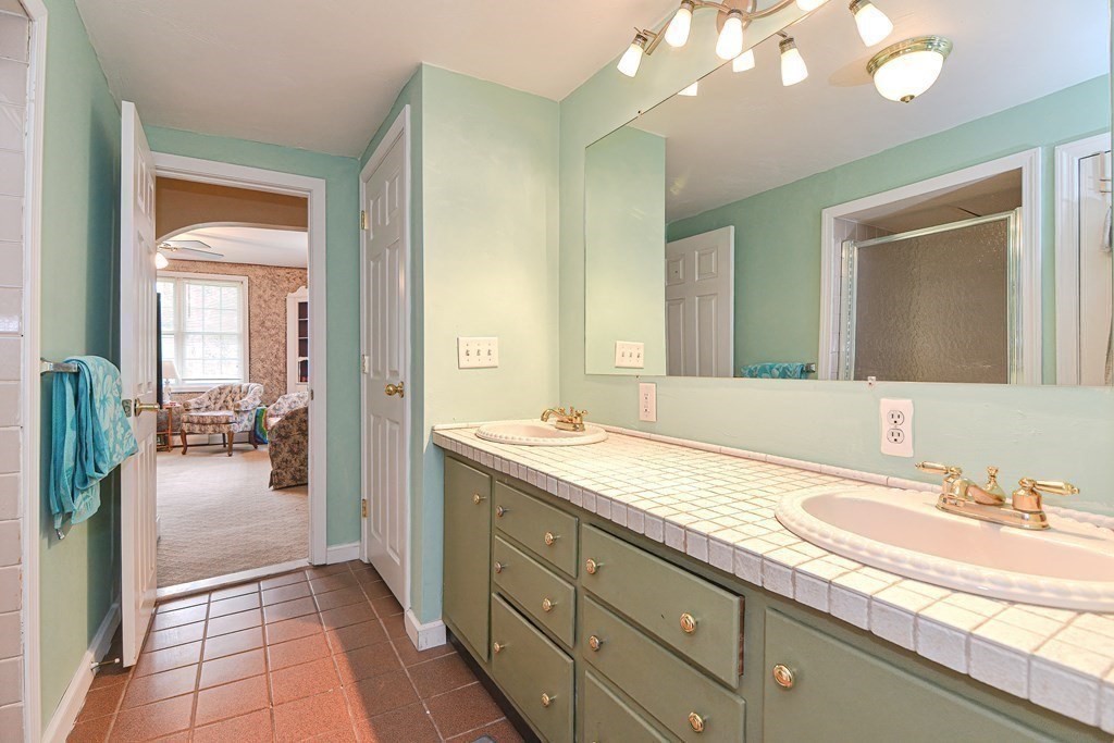 34 South Spencer Road Spencer, MA 01562 - Photo 13 of 34 a spacious bathroom with a granite countertop sink a mirror and a shower