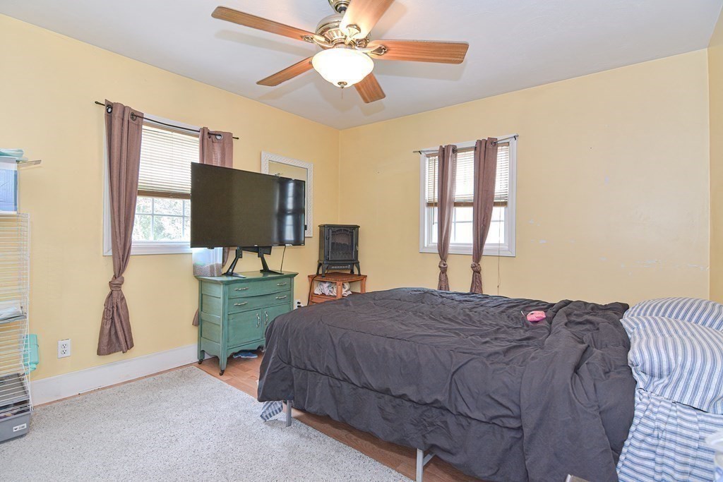34 South Spencer Road Spencer, MA 01562 - Photo 16 of 34 a bedroom with a bed and a flat screen tv