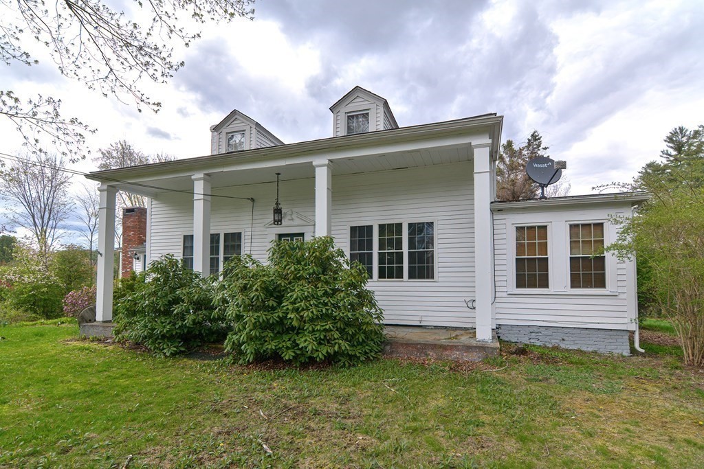 34 South Spencer Road Spencer, MA 01562 - Photo 2 of 34 a front view of a house with a garden