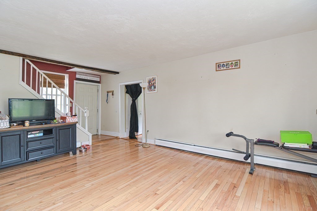 34 South Spencer Road Spencer, MA 01562 - Photo 22 of 34 a living room with furniture and a flat screen tv