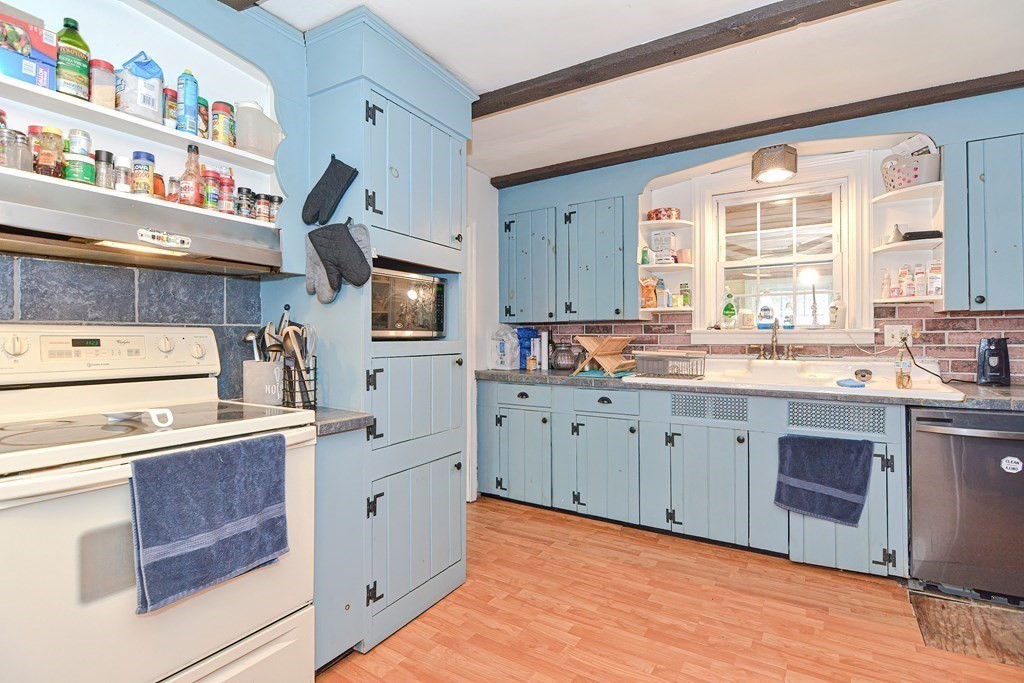 34 South Spencer Road Spencer, MA 01562 - Photo 6 of 34 a kitchen with stainless steel appliances granite countertop a stove a sink and a refrigerator