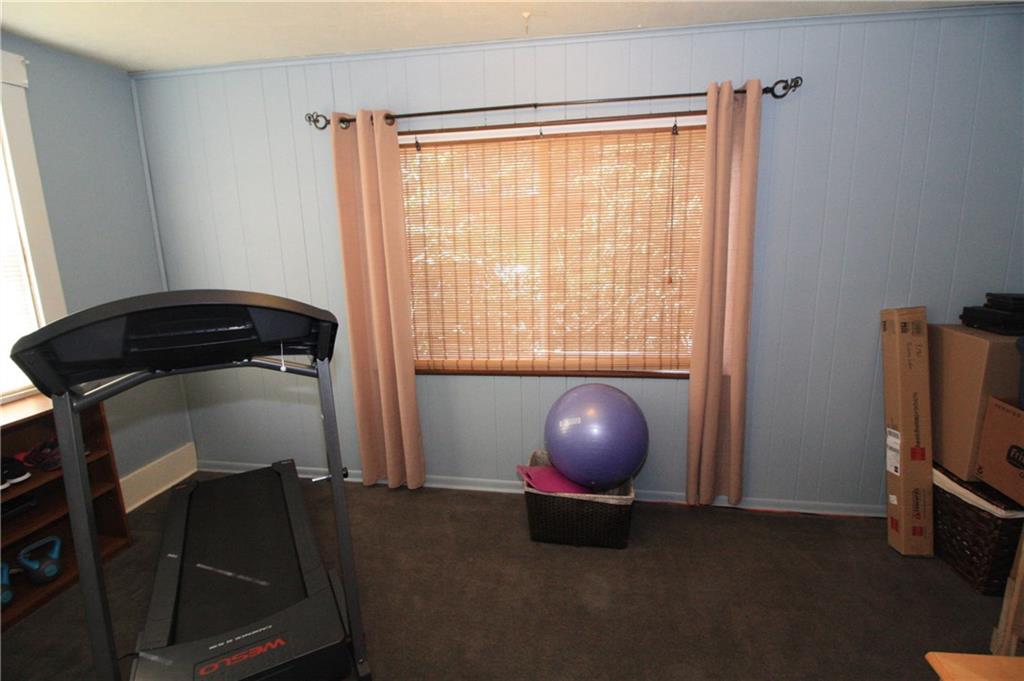 The den would be great for an exercise room or home office. 