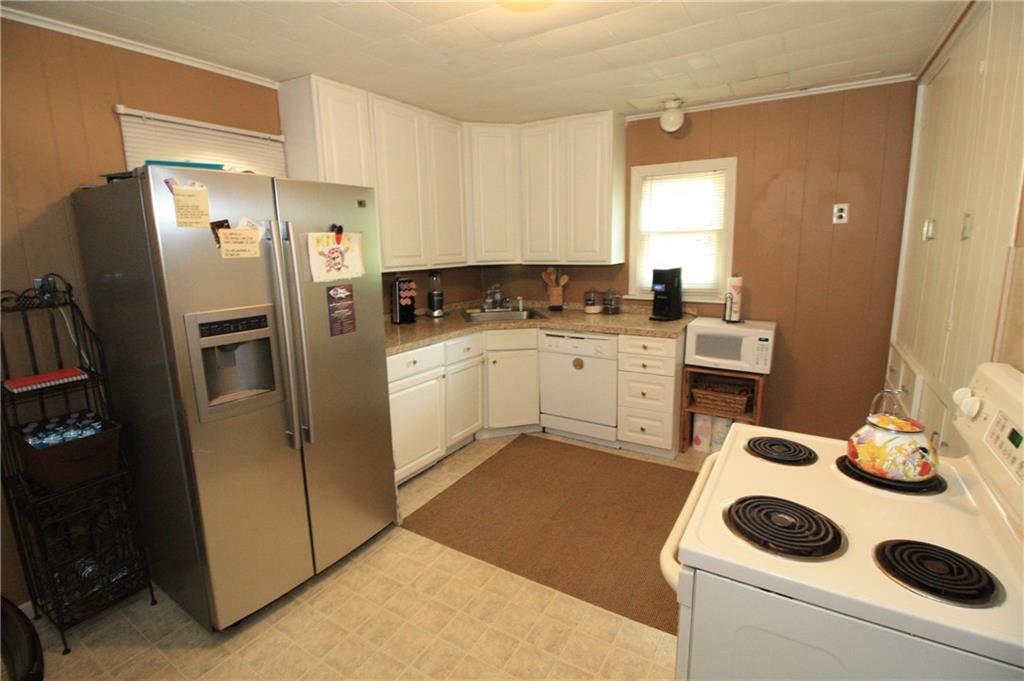 This kitchen features a large pantry cupboard for all of your ingredients and cooking gadgets.
