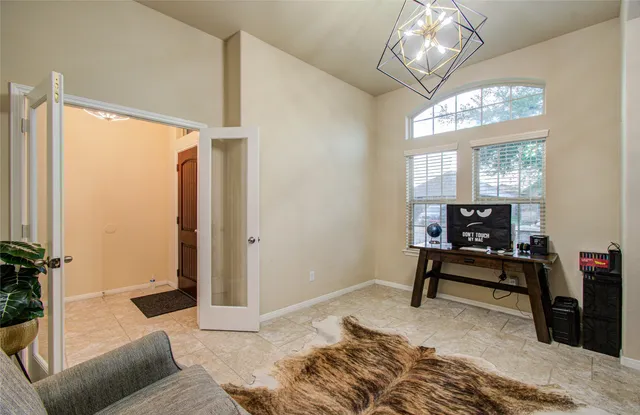 a bedroom with furniture and a window