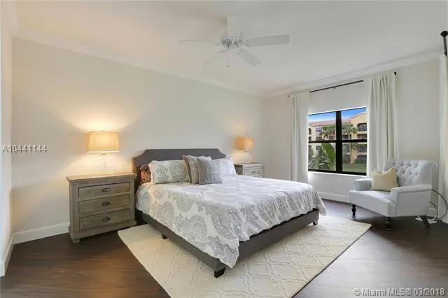 a bathroom with a granite countertop sink a mirror and a shower