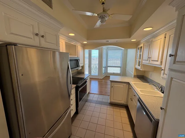 a kitchen with a refrigerator a sink and dishwasher
