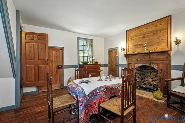 a view of a livingroom with furniture window and wooden floor