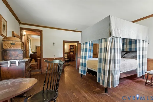 a view of a hallway with entryway wooden floor and front door