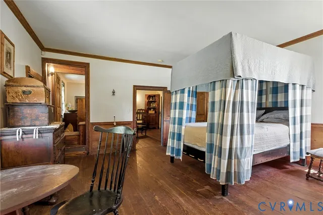 a view of a hallway with entryway wooden floor and front door