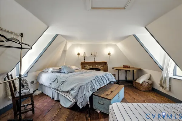 a bedroom with a bed and a ceiling fan