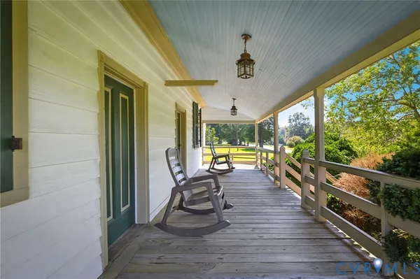 a view of a living room and balcony