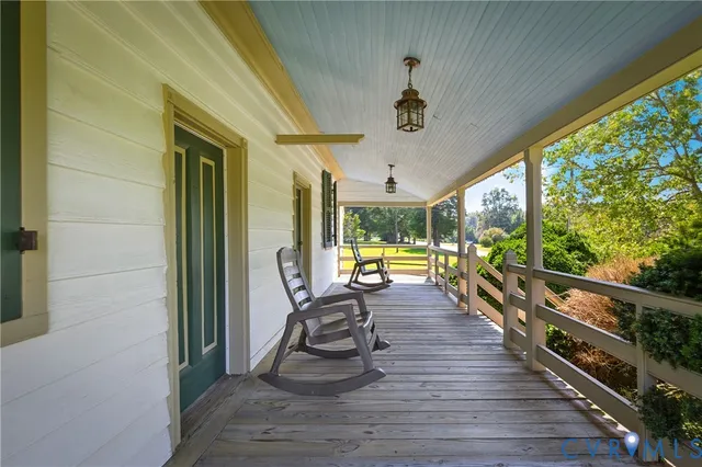 a view of a living room and balcony