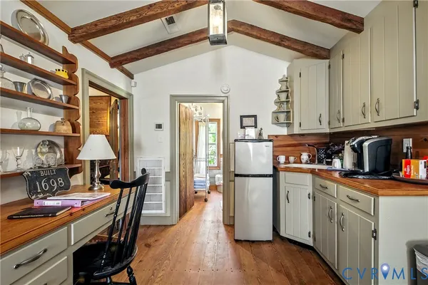 a bathroom with a granite countertop toilet a sink and a mirror