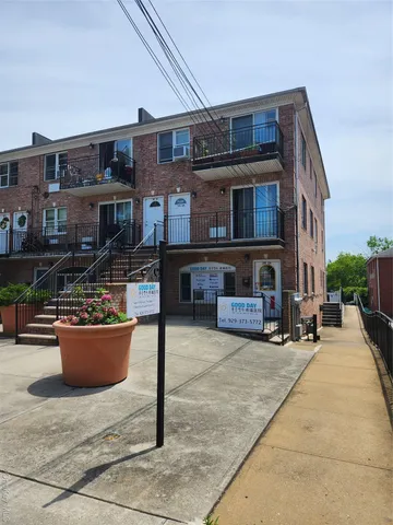 a view of a building with sitting area