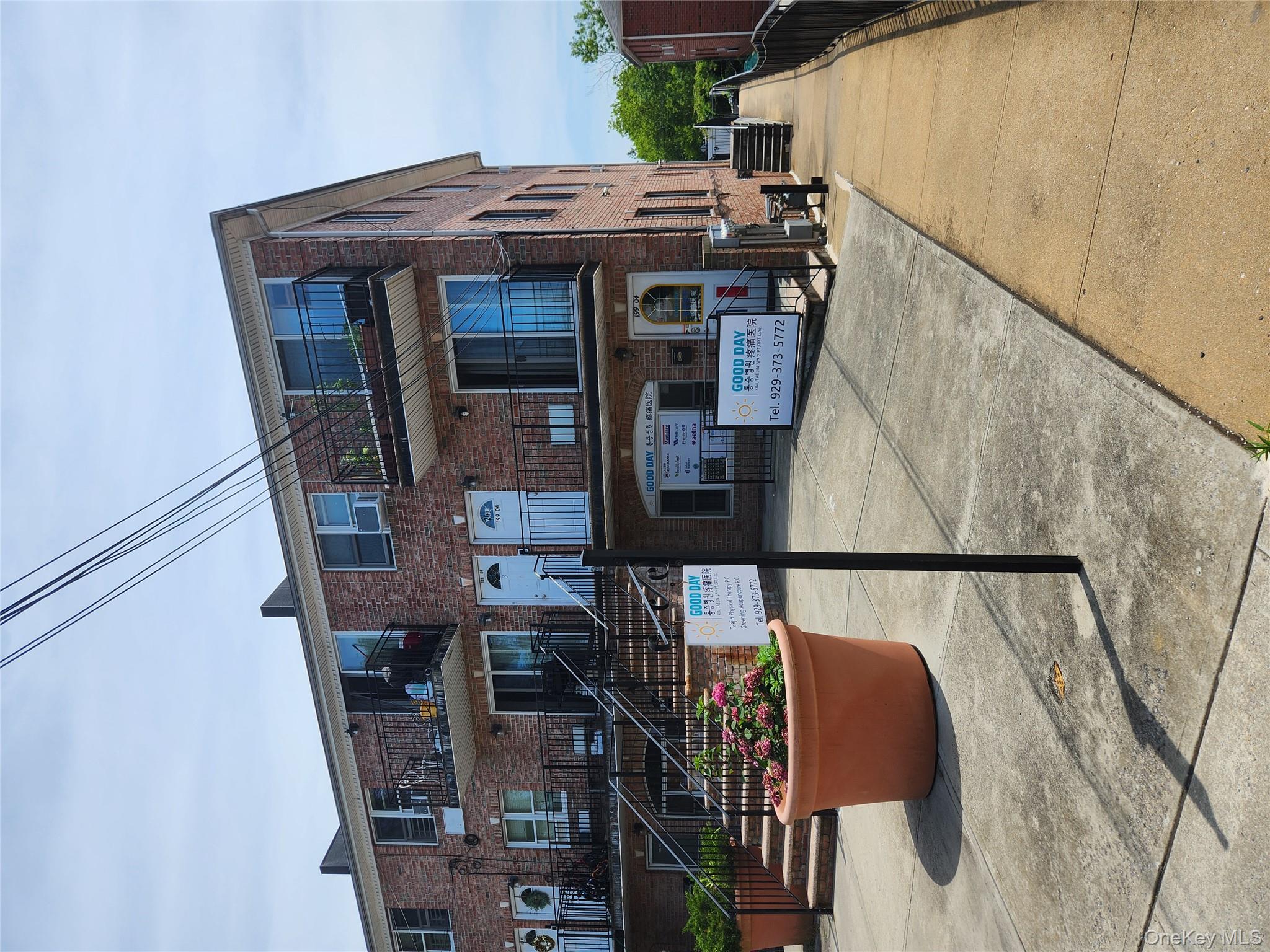 199-04 47th Avenue Queens, NY 11358 - Photo 1 of 5 a view of a building with sitting area