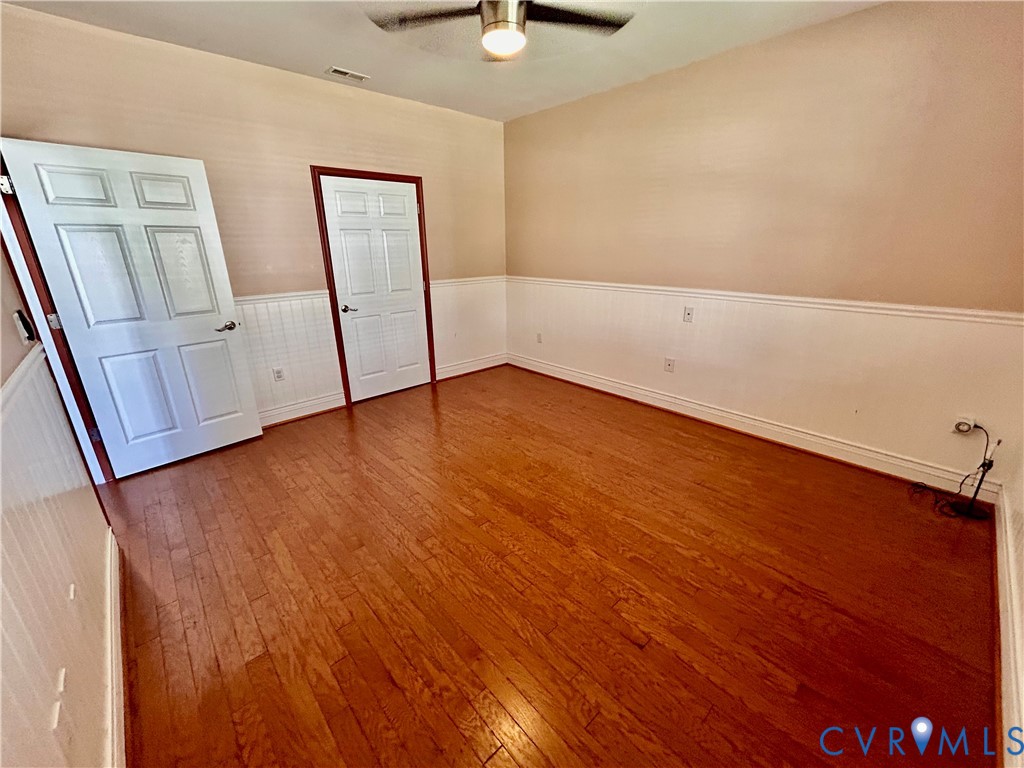 14537 Parracombe Lane Midlothian, VA 23112 - Photo 14 of 50 a view of an empty room with wooden floor and a window