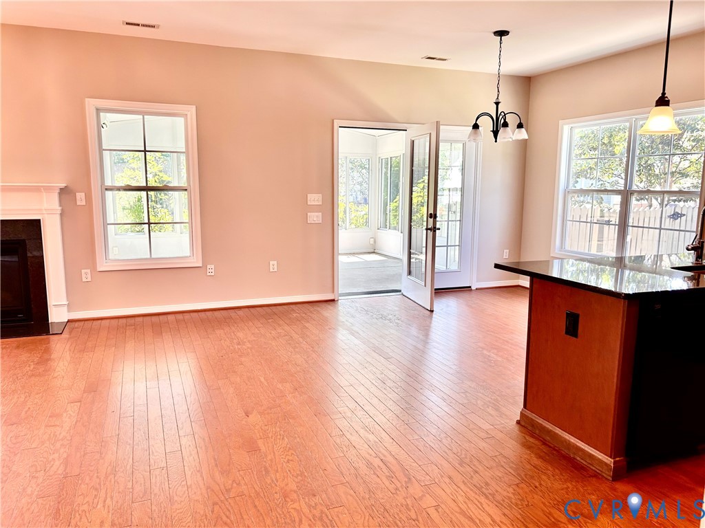 14537 Parracombe Lane Midlothian, VA 23112 - Photo 25 of 50 an empty room with wooden floor and windows