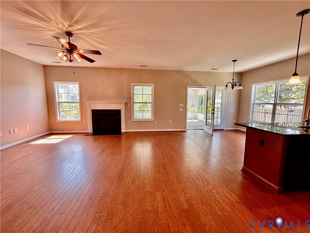 14537 Parracombe Lane Midlothian, VA 23112 - Photo 28 of 50 a view of an empty room with a window and wooden floor