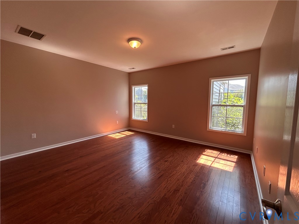 14537 Parracombe Lane Midlothian, VA 23112 - Photo 32 of 50 a view of empty room with wooden floor and fan