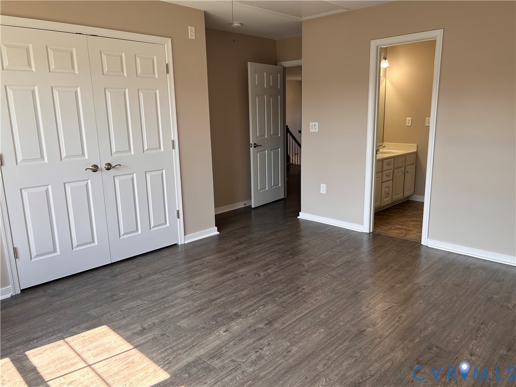 14537 Parracombe Lane Midlothian, VA 23112 - Photo 35 of 50 a view of an empty room with wooden floor and a window