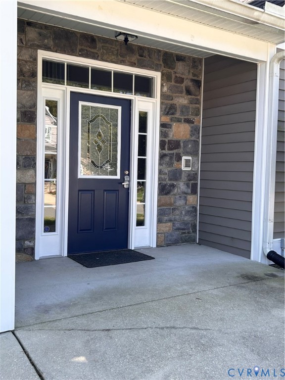 14537 Parracombe Lane Midlothian, VA 23112 - Photo 8 of 50 a view of a brick house with large windows