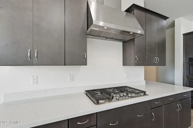 an empty room with a ceiling fan and window